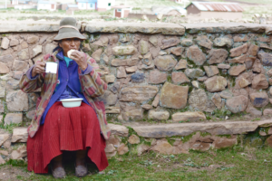 old native american woman eating outside - Altitude in Cusco: How to Prepare and Enjoy Your Trip