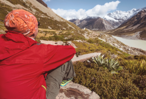 hiker-beautiful-mountains-near-mount-cook-new-zealand-south-island hiker beautiful mountains near mount cook new zealand south island - The Ultimate Expedition to Cotopaxi Volcano: A Journey to the Peak of the Andes - Columbus Travel Ecuador