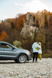couple enjoying autumn road trip in the countryside